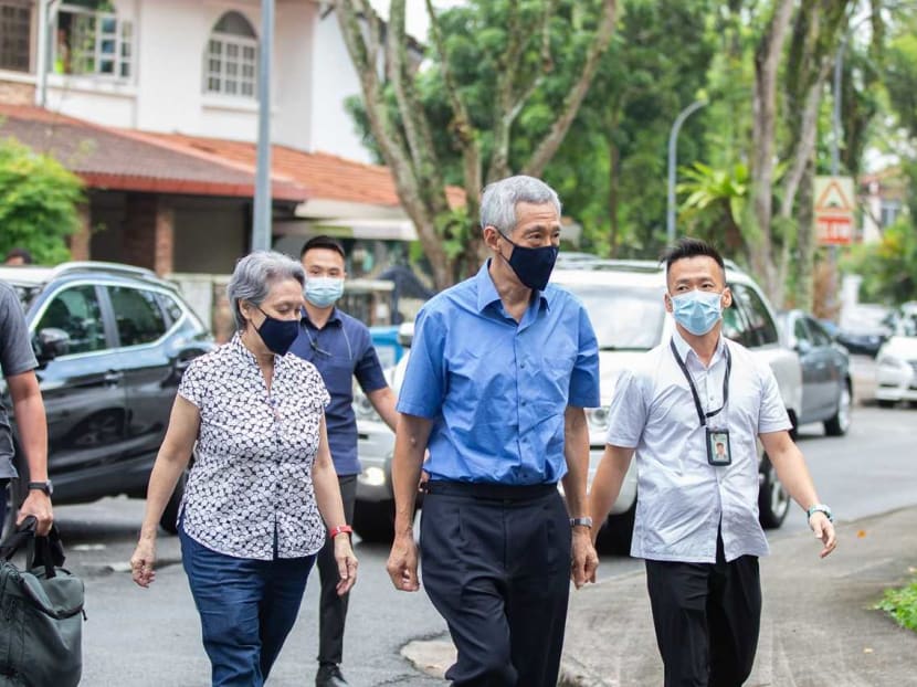 Prime Minister Lee Hsien Loong (second from right) and his wife Ho Ching arriving at the wake for Richard Magnus on Hillcrest Road on March 15, 2022. u00e2u20acu2022 TODAY pic