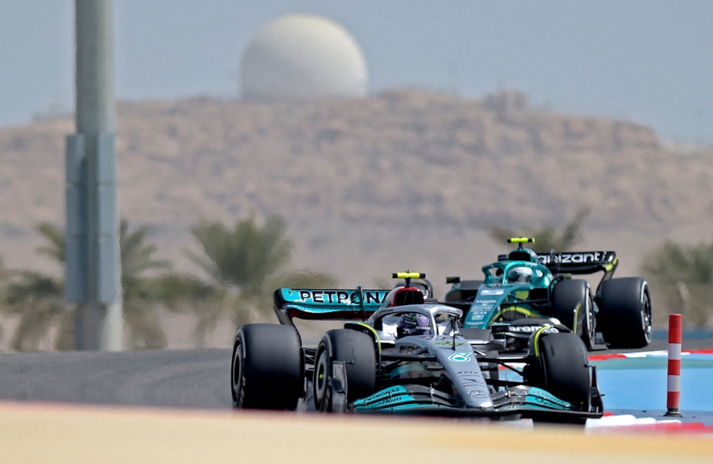 Mercedes driver Lewis Hamilton and Aston Martin driver Sebastian Vettel (right) drive during the first day of Formula One pre-season testing at the Bahrain International Circuit in the city of Sakhir, March 10, 2022. u00e2u20acu201d AFP Pic 