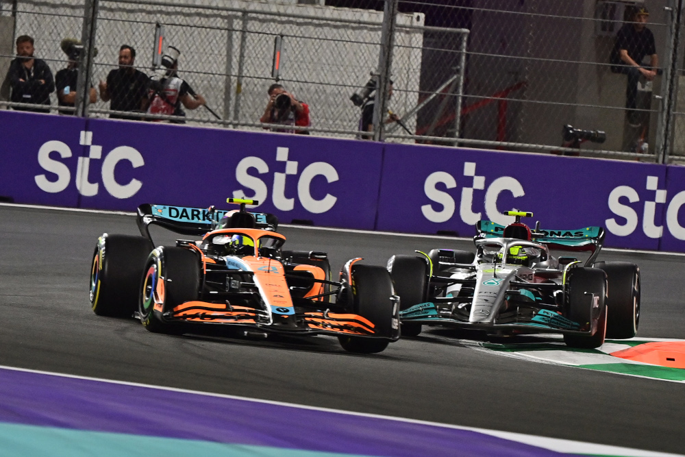 McLaren driver Lando Norris and Mercedes driver Lewis Hamilton vie for position during the 2022 Saudi Arabia Formula One Grand Prix at the Jeddah Corniche Circuit, March 27, 2022. u00e2u20acu201d AFP pic 