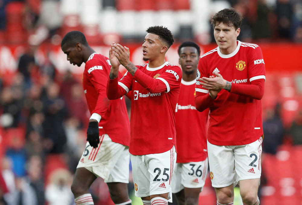 Manchester Unitedu00e2u20acu2122s Jadon Sancho and Victor Lindelof applaud fans after the match against Watford at Old Trafford, Manchester, Britain, February 26, 2022. u00e2u20acu2022 Reuters pic 