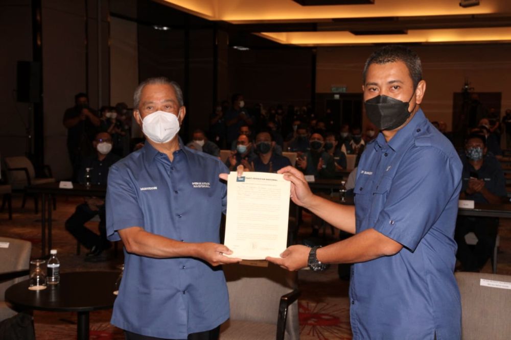 Tan Sri Muhyiddin Yassin (left) with Johor PN secretary Datuk Dr Sahruddin Jamal are pictured at the Impiana Hotel in Senai, Kulai March 3, 2022. u00e2u20acu201d Picture by Ben Tannn