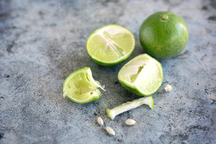 Zesty limes give the final dish a refreshing tanginess.