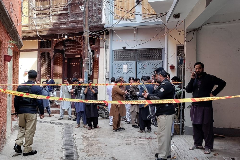 Policemen cordon off a street leading to a mosque after a bomb blast in Peshawar on March 4, 2022. At least 30 people were killed and 56 wounded in a huge blast at a mosque in the northwestern Pakistani city of Peshawar, a hospital official said. u00e2u20acu201d AFP 