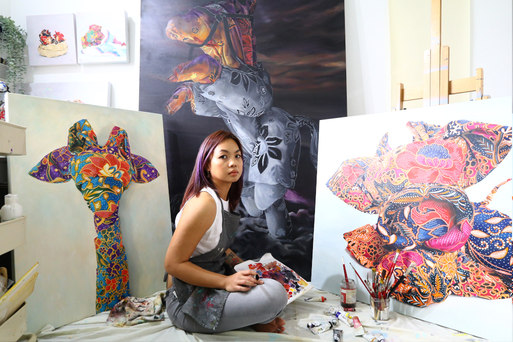 Penang artist Mandy Maung with her oil paintings of Orikata Tales. u00e2u20acu201d Picture courtesy of Oh Chin Eng