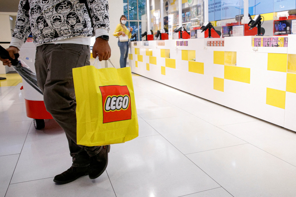 A customer carries a bag while shopping in the 5th Avenue Lego store in New York September 28, 2021. u00e2u20acu201d Reuters pic