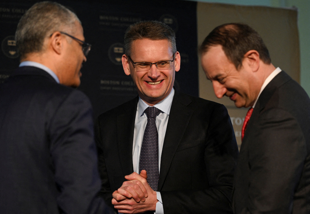 National Grid CEO John Pettigrew speaks with The Partnership CEO Pratt N. Wiley and Executive Director of the Boston College Chief Executives Club at the Boston College Chief Executives Club luncheon in Boston March 17, 2022. u00e2u20acu201d Reuters pic