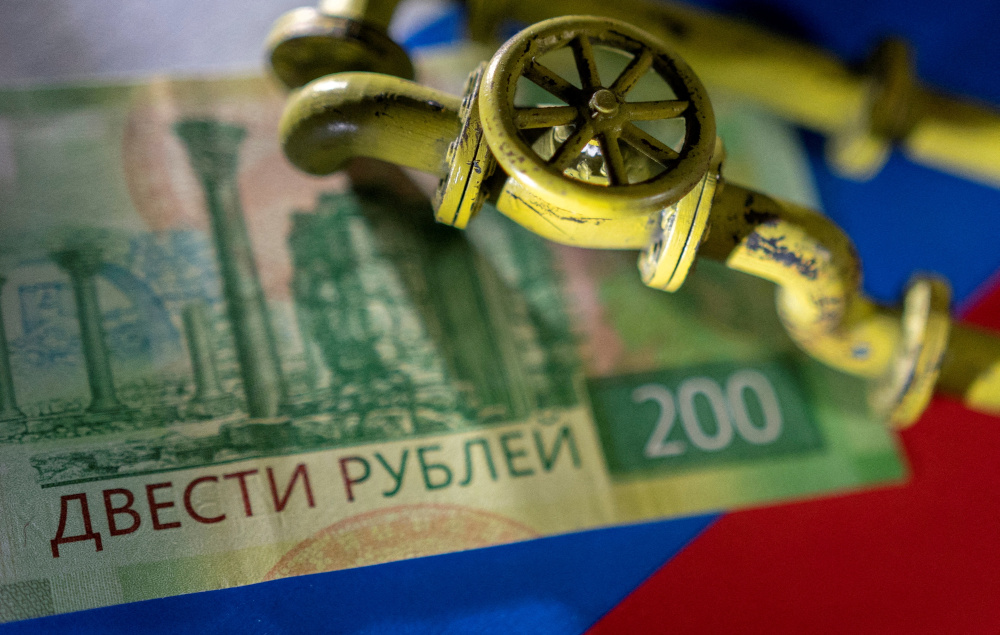 A model of the natural gas pipeline is placed on Russian rouble banknote and a flag in this illustration taken, March 23, 2022. u00e2u20acu201d Reuters pic