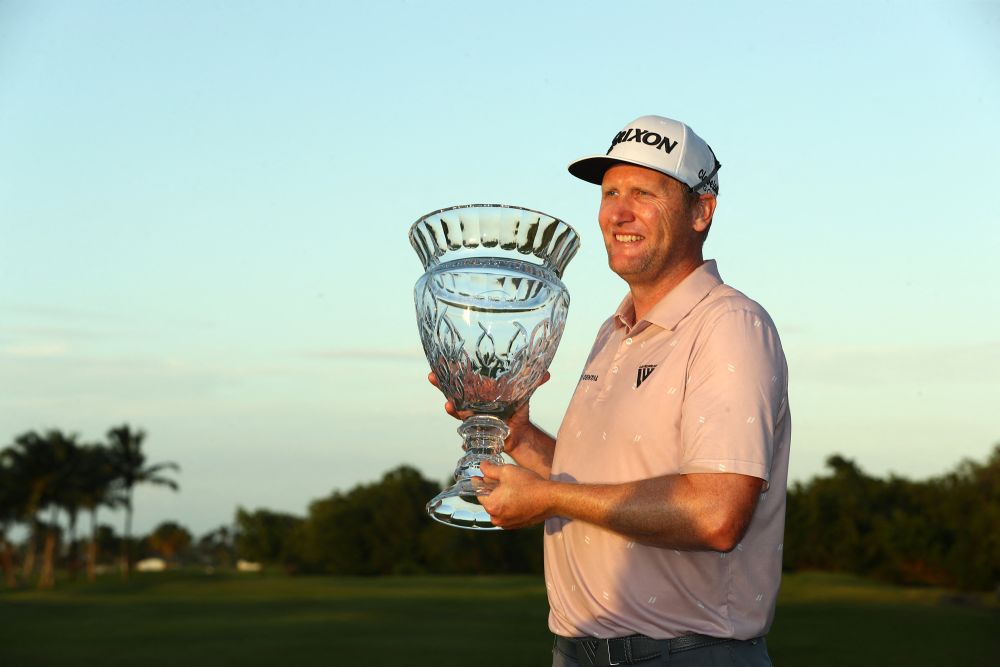 Ryan Brehm poses with the trophy on the 18th green during the final round of the Puerto Rico Open at Grand Reserve Golf Club in Rio Grande March 6, 2022. u00e2u20acu201d AFP picnn