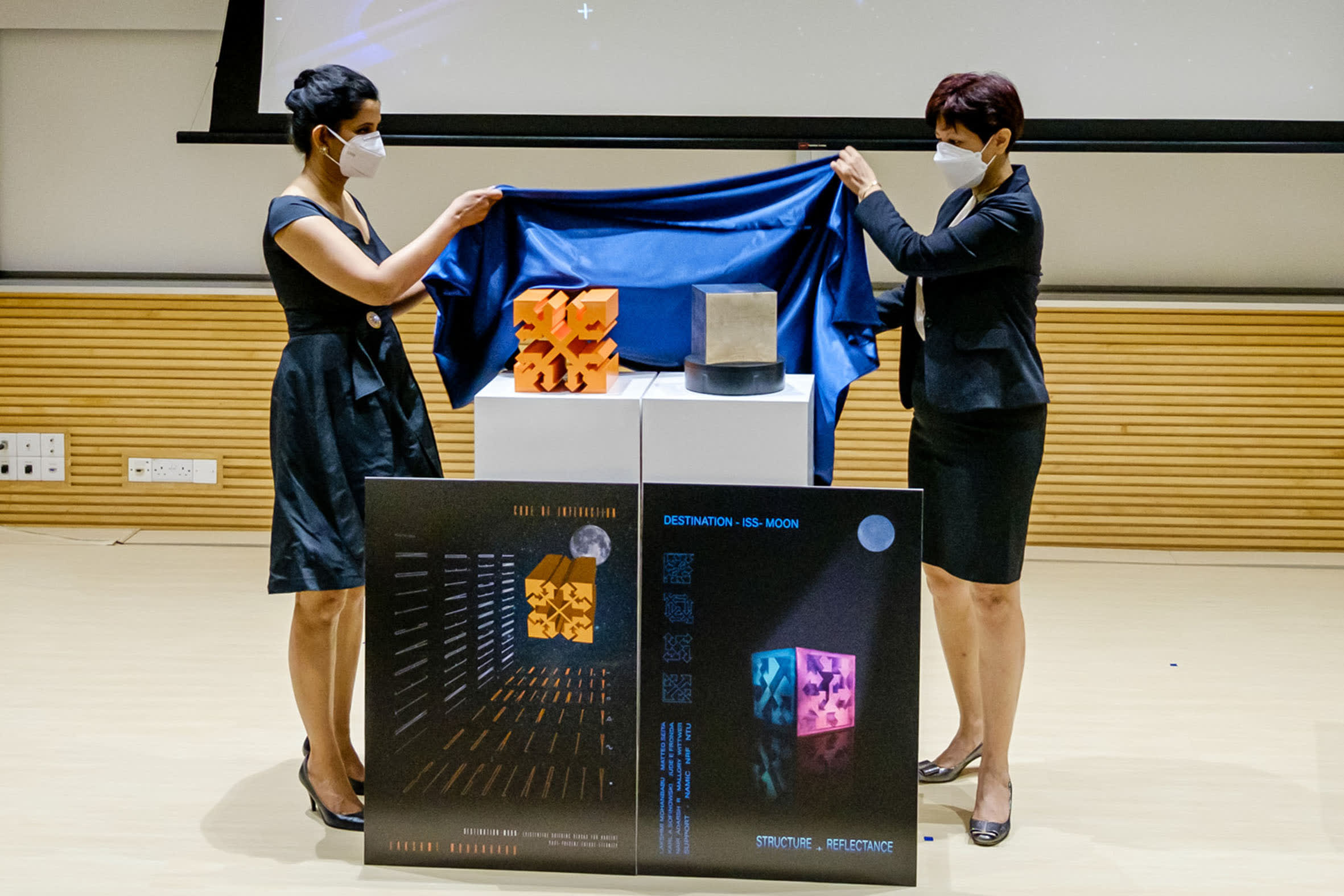 Artist Lakshmi Mohanbabu (left) and Minister in the Prime Minister's Office Indranee Rajah unveiling the large replicas of the two Singapore artworks. u00e2u20acu2022 Picture courtesy of Nanyang Technological University