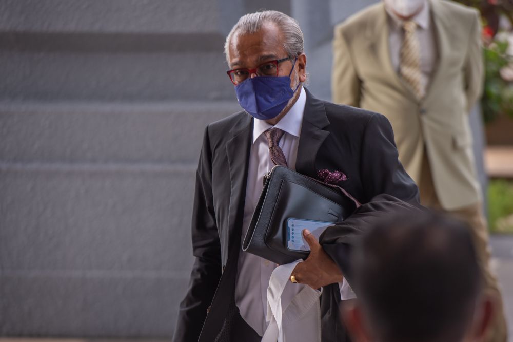 Lawyer Tan Sri Muhammad Shafee Abdullah arrives at the Kuala Lumpur High Court March 21, 2022. — Picture by Shafwan Zaidon