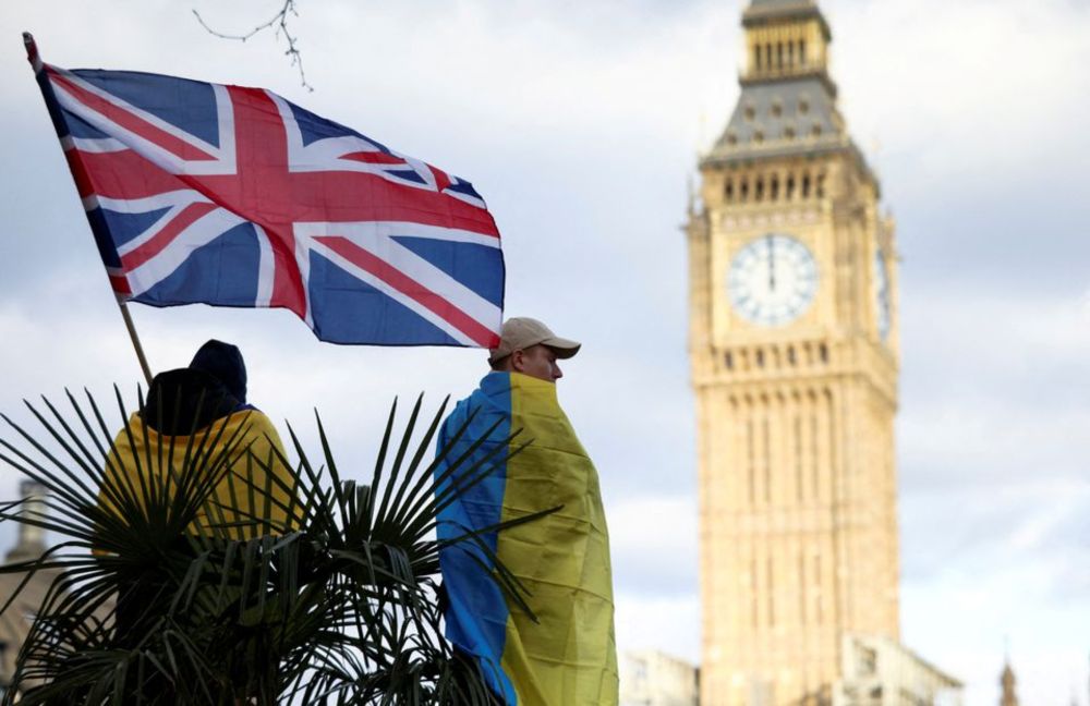 A demonstrator holds a British flag during a protest against Russiau00e2u20acu2122s invasion of Ukraine, at Parliament Square in London, March 6, 2022. u00e2u20acu201d Reuters pic