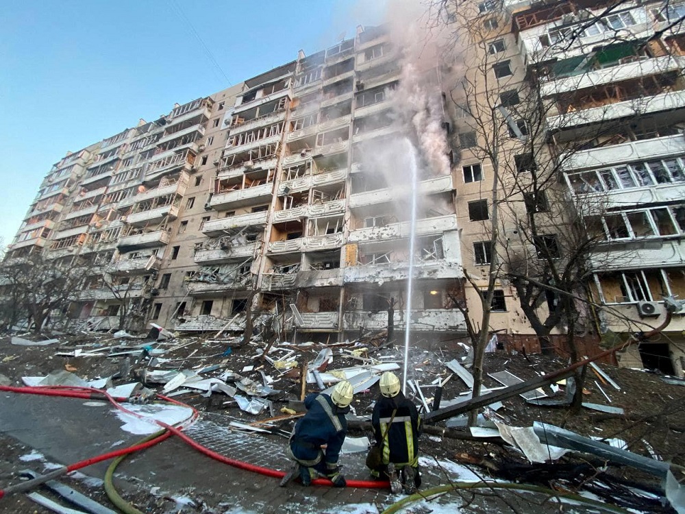 Rescuers work next to a residential building damaged by shelling, as Russia's attack on Ukraine continues, in Kyiv, Ukraine, in this handout picture released March 15, 2022. u00e2u20acu2022 Press service of the State Emergency Service of Ukraine/Handout via Reuters