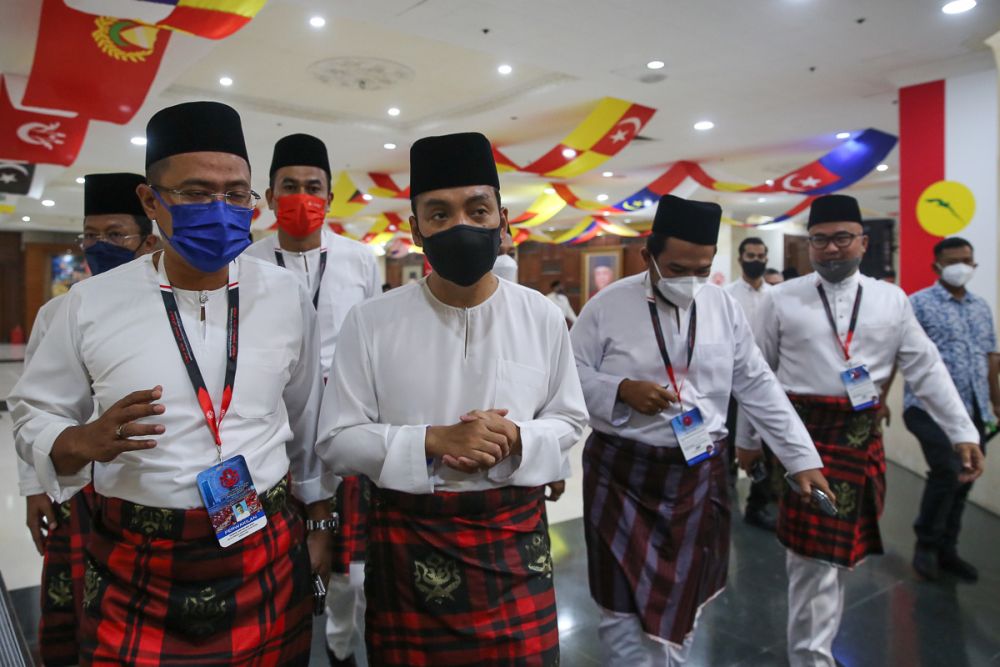 Johor Mentri Besar Datuk Onn Hafiz Ghazi (centre) attends the 2021 Umno General Assembly in Kuala Lumpur March 17, 2022. — Picture by Yusof Mat Isa