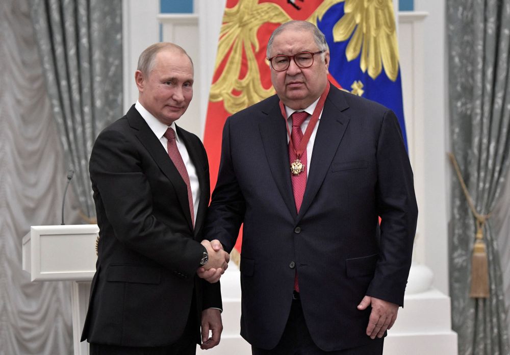 Russian President Vladimir Putin (left) shakes hands with Russian businessman Alisher Usmanov during an awards ceremony at the Kremlin in Moscow November 27, 2018. u00e2u20acu201d Reuters picnn