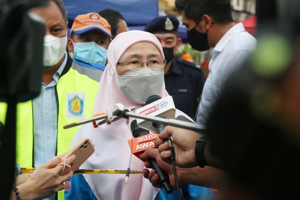Datuk Seri Wan Azizah Wan Ismail speaks to reporters during a visit to the site of the landslide at Taman Bukit Permai 2, Ampang March 11, 2022. — Picture by Choo Choy May