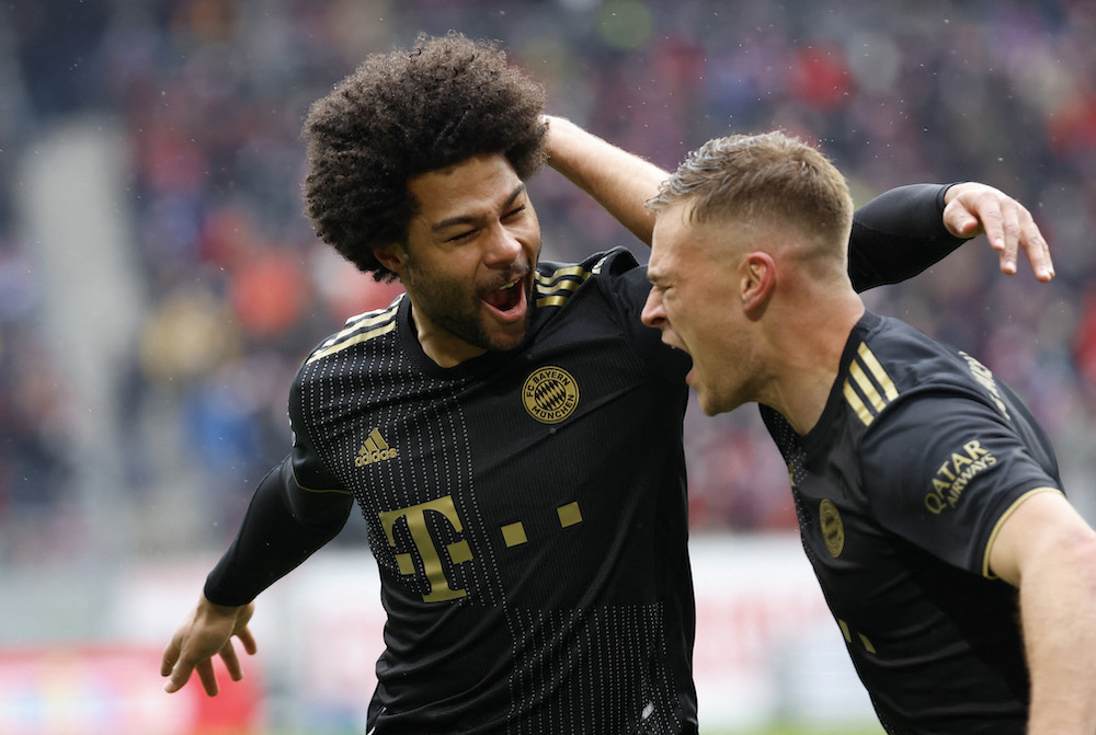 Bayern Munich's Serge Gnabry celebrates scoring their second goal with Joshua Kimmich in Freiburg April 2, 2022. u00e2u20acu201d Reuters/Heiko Becker pic