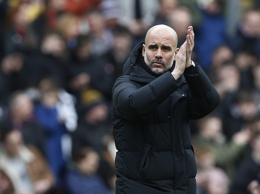 Manchester City manager Pep Guardiola applauds fans after the match in Burnley April 3, 2022. u00e2u20acu201d Reuters/Craig Brough pic 