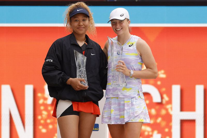 Iga Swiatek holds the Butch Buchholz Championship Trophy as Naomi Osaka holds the finalists' trophy during the awards ceremony after their women's singles final in the Miami Open. u00e2u20acu201d Geoff Burke-USA TODAY Sports pic