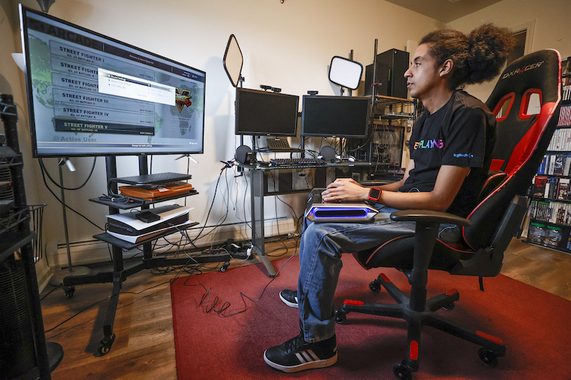 Chris Robinson plays a video game in his apartment in Justice, Illinois March 26, 2022,. u00e2u20acu201d AFP pic