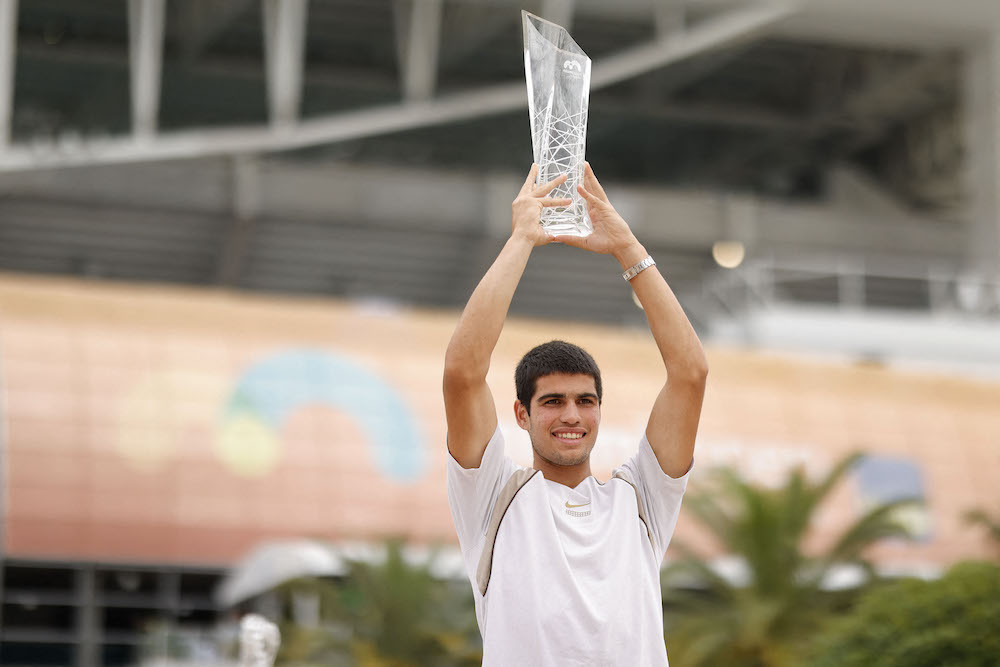 Carlos Alcaraz poses for a portrait while holding the Butch Buchholz Championship Trophy after winning the men's singles final in the Miami Open. u00e2u20acu201d Geoff Burke-USA TODAY Sports pic