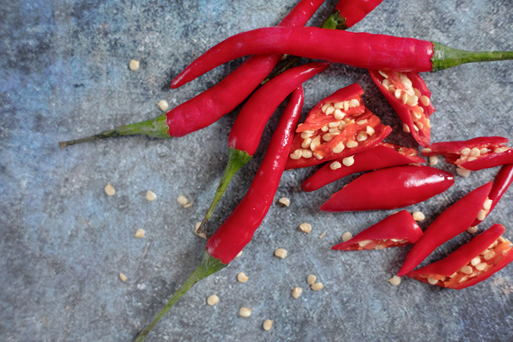 Use red chillies or red 'cili padi' (bird’s eye chillies), both for their heat as well as their sharp red colour.