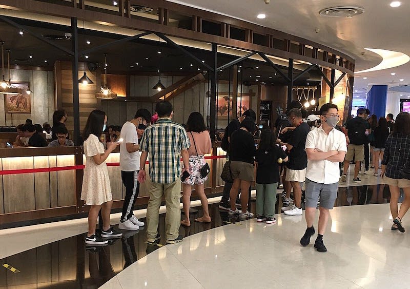 A queue of people waiting to be seated at a restaurant in VivoCity mall. — TODAY pic