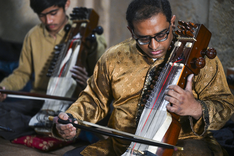 In this picture taken on February 24, 2022, Zohaib Hassan teaches his students to play sarangi at his academy in Lahore. u00e2u20acu201d AFP pic
