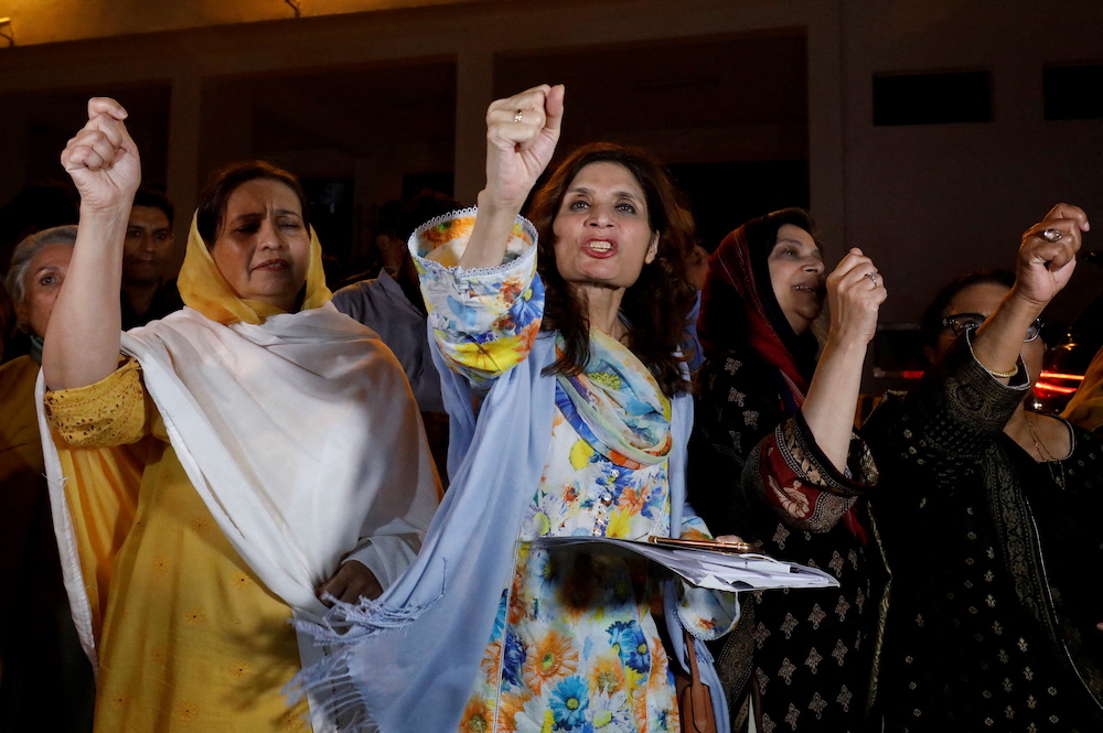 Supporters of former Pakistani Prime Minister Imran Khan chant slogans as they protest after he lost a confidence vote in the lower house of parliament, in Islamabad, Pakistan April 10, 2022. u00e2u20acu201d Reuters pic