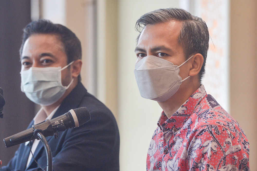 Representative of Datuk Seri Anwar Ibrahim, Fahmi Fadzil and representative of Datuk Seri Najib Razak, Isham Jalil speaks during a press conference on the Najib vs Anwar debate, Kuala Lumpur April 17, 2022. u00e2u20acu201d Picture by Miera Zulyana