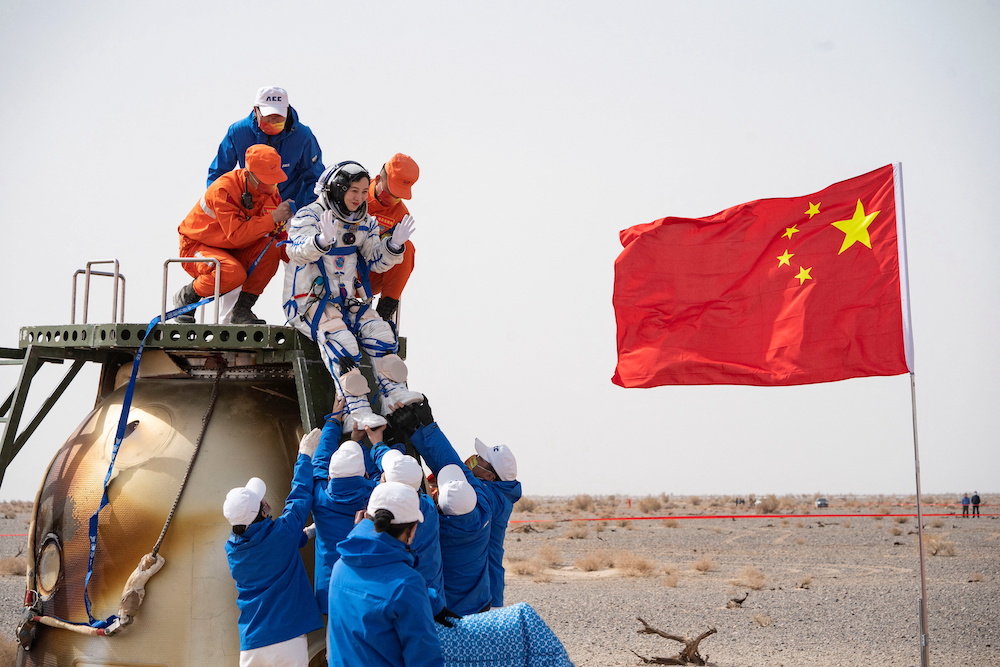 Rescue workers carry Chinese astronaut Wang Yaping out of a return capsule following the Shenzhou-13 manned space mission to complete construction of the space station, April 16, 2022. u00e2u20acu201d China Daily pic via Reuters