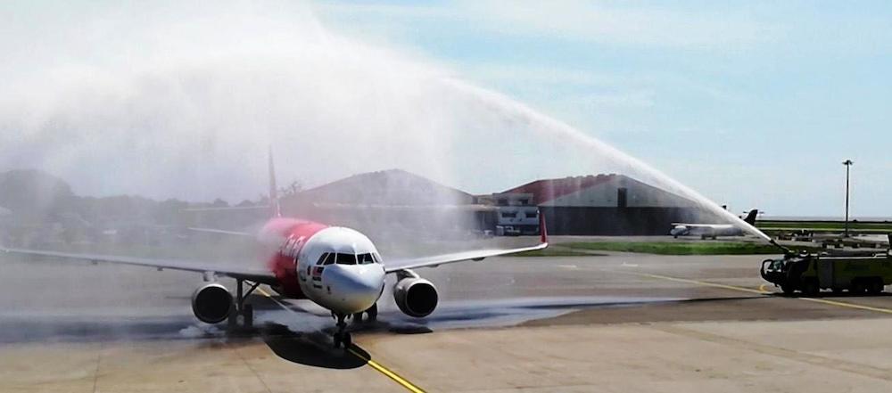 AirAsia AK 1794 flight receives a water cannon salute as Sabah welcomes its first international flight via Singapore at the Kota Kinabalu International Airport. u00e2u20acu201d Borneo Post pic