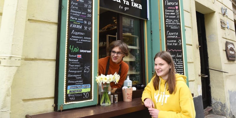 Ivan Denchenko (left), 19, and Daryna Mazur, 21, who work at the Kiit cafe, pose for a photo in the western Ukrainian city of Lviv. u00e2u20acu201d AFP pic