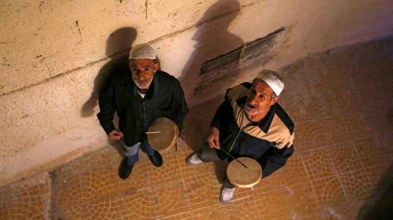 Traditional dawn awakeners known as 'Musaharati' beat drums and chant religious songs to wake up Muslims before sunrise for the 'sahur' meal before the day's fast during the holy month of Ramadan. u00e2u20acu201d AFP pic