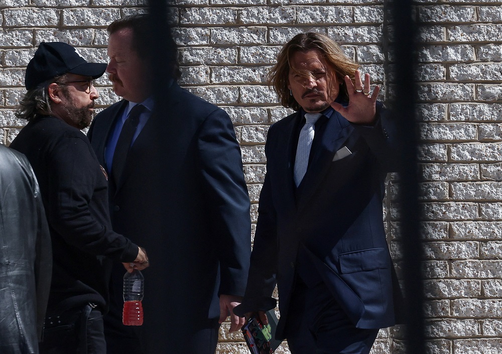 Johnny Depp reenters the Fairfax County Judicial Centre following a break during the defamation case against Amber Heard in Fairfax, Virginia April 12, 2022. u00e2u20acu201d Reuters pic