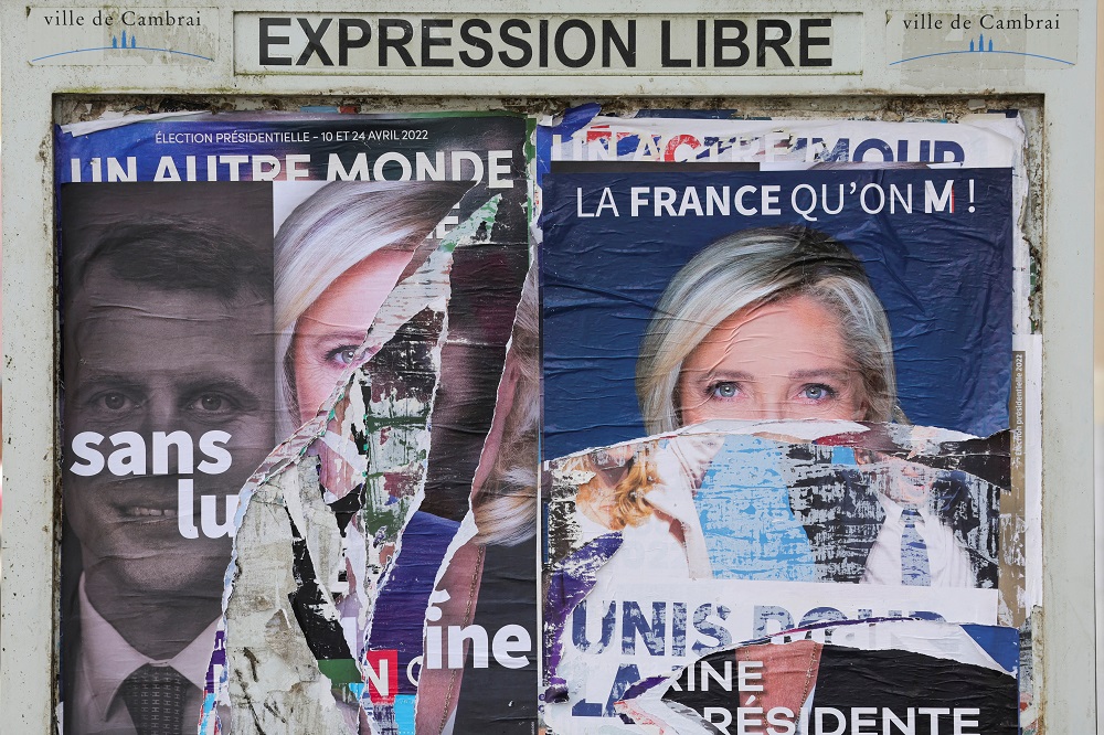 A torn poster in support of Marine Le Pen, leader of French far-right National Rally party and candidate for the 2022 French presidential election, is pictured on a free billboard in Cambrai, France April 15, 2022. u00e2u20acu201d Reuters pic
