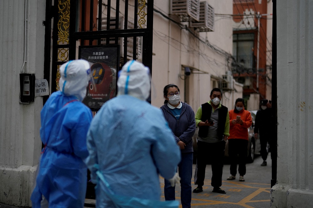 Residents line up for nucleic acid tests during a lockdown, amid the coronavirus disease pandemic, in Shanghai April 16, 2022. u00e2u20acu201d Reuters pic