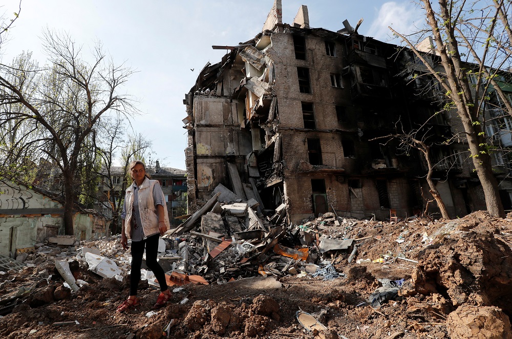 Local resident and social worker Oksana Khvostenko, 47, stands near her house, which was heavily damaged during Ukraine-Russia conflict in the southern port city of Mariupol April 29, 2022. u00e2u20acu201d Reuters pic