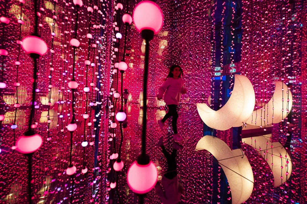 People visit the ‘You are the Moon’ room inside the Youseum in Solna, near Stockholm April 4, 2022. — AFP pic