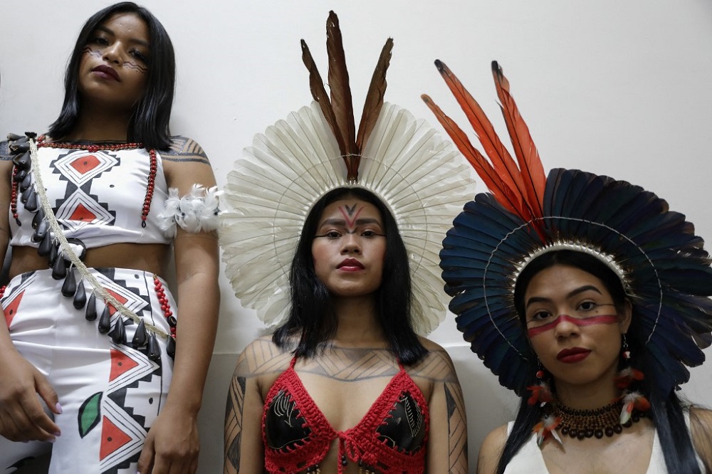 Indigenous models pose during a fashion event in Manaus, Amazon on April 9, 2022. u00e2u20acu201d AFP pic