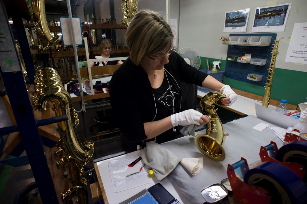 This file photo taken January 17, 2018 shows an employee assembling a Saxophone at the Selmer Saxophone factory in Mantes-la-Ville, outside Paris. u00e2u20acu201d AFP pic