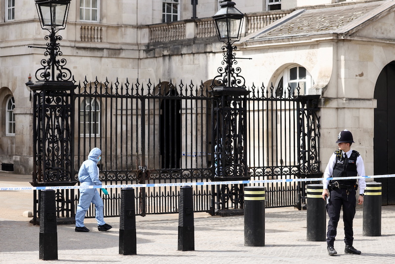 A police forensic official walks outside the Horse Guards after the road was closed by police following an incident involving the arrest of a man near Downing Street, in London, Britain, April 18, 2022. u00e2u20acu201d Reuters pic
