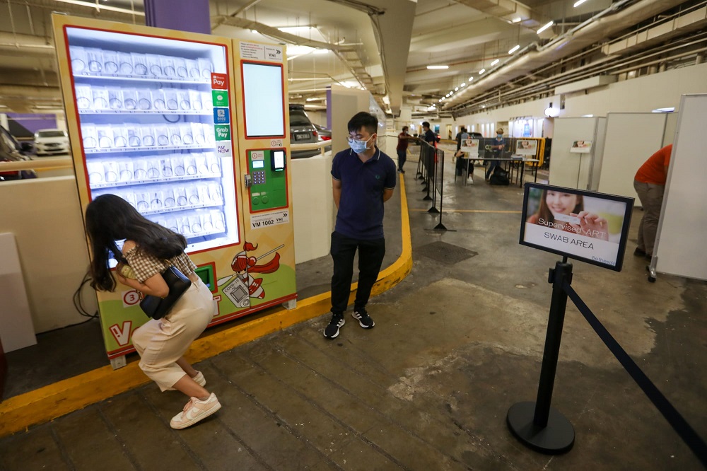 Zouk patrons at an ART station at the Clarke Quay car park next to Zouk Club, April 20, 2022. — TODAY pic