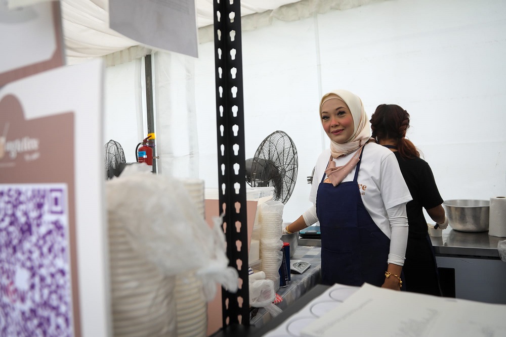 Didi Rahman at her stall selling edible cookie dough at the Ramadan bazaar in Kampong Gelam, April 24, 2022. — TODAY pic 