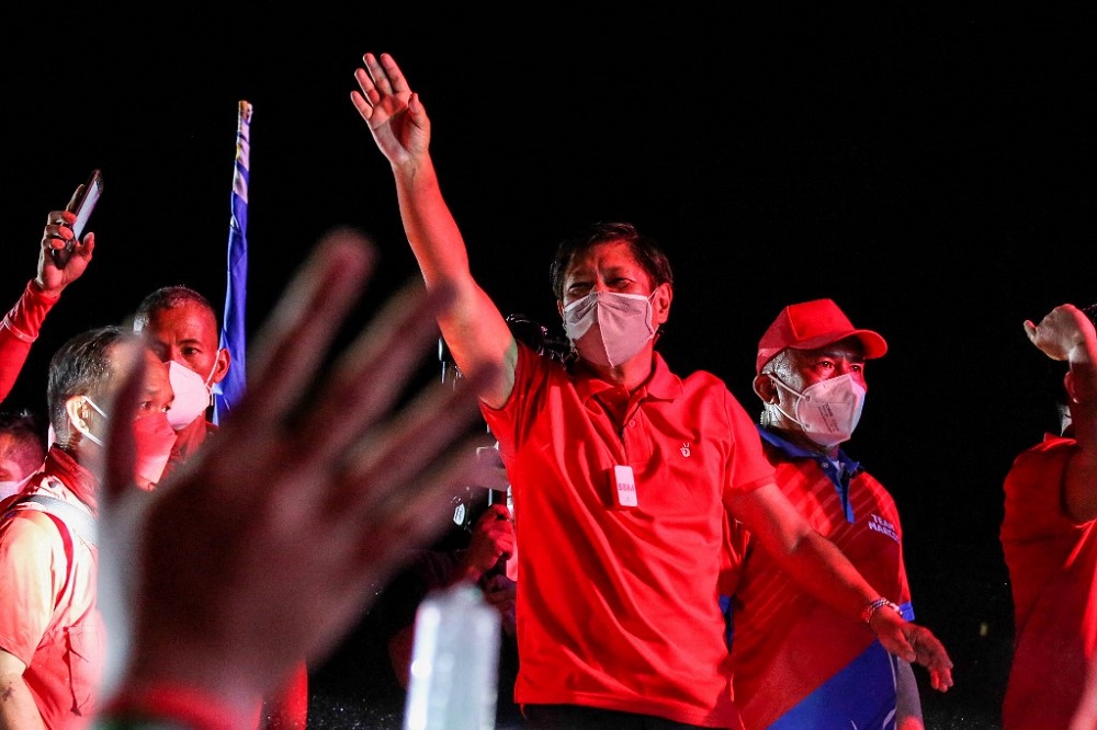 Presidential candidate Ferdinand Marcos Jr (centre) waving during a campaign rally in Taguig, suburban Manila April 24, 2022. u00e2u20acu201d AFP pic