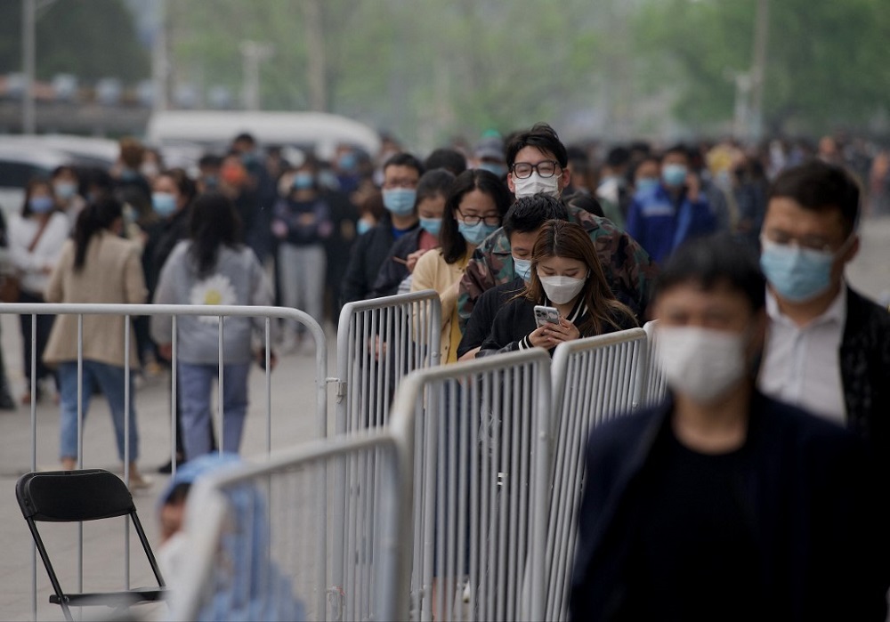 People queue for a swab test to be tested for Covid-19 coronavirus at a swab collection site in Beijing April 25, 2022. u00e2u20acu201d AFP pic
