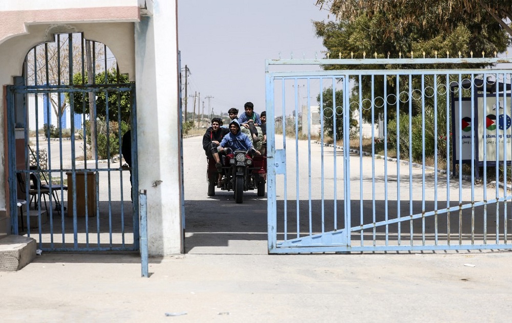 Young men ride a vehicle at the Palestinian Authority side of the Erez Crossing in Beit Hanoun in the northern Gaza Strip, on April 23, 2022. u00e2u20acu201d AFP pic