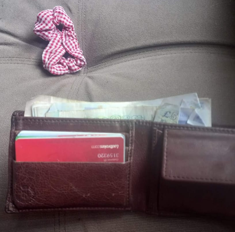 The wallet was wedged underneath the cabu00e2u20acu2122s seat before it was found by the driver recently. u00e2u20acu201d Picture via Facebook/Andy Evans