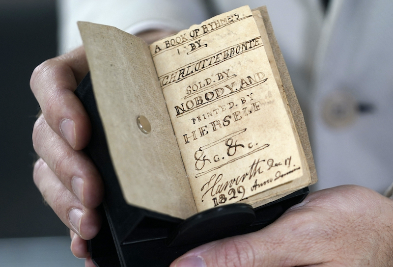 A miniature of the unpublished manuscript titled u00e2u20acu02dcA Book of Rhymes by Charlotte Bronte, Sold by Nobody, and Printed by Herselfu00e2u20acu2122 written by English novelist and poet Charlotte Bronte on display in New York City April 21, 2022. u00e2u20acu201d AFP pic
