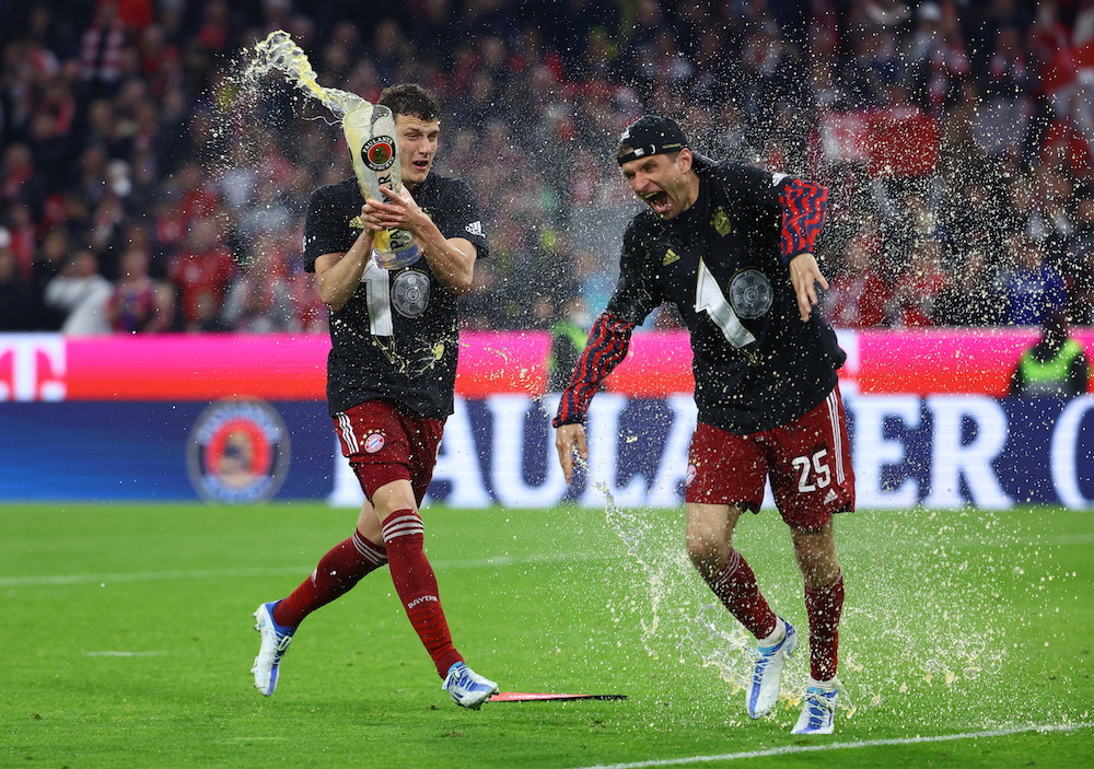 Bayern Munich's Thomas Muller celebrates with Benjamin Pavard after winning the Bundesliga, Munich April 23, 2022. u00e2u20acu201d Reuters pic 