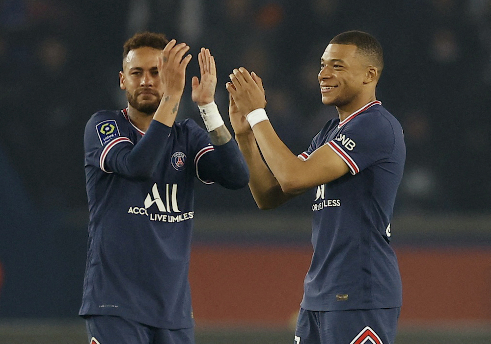 Paris St Germain's Kylian Mbappe celebrates with Neymar after winning Ligue 1, Paris April 23, 2022. u00e2u20acu201d Reuters pic 